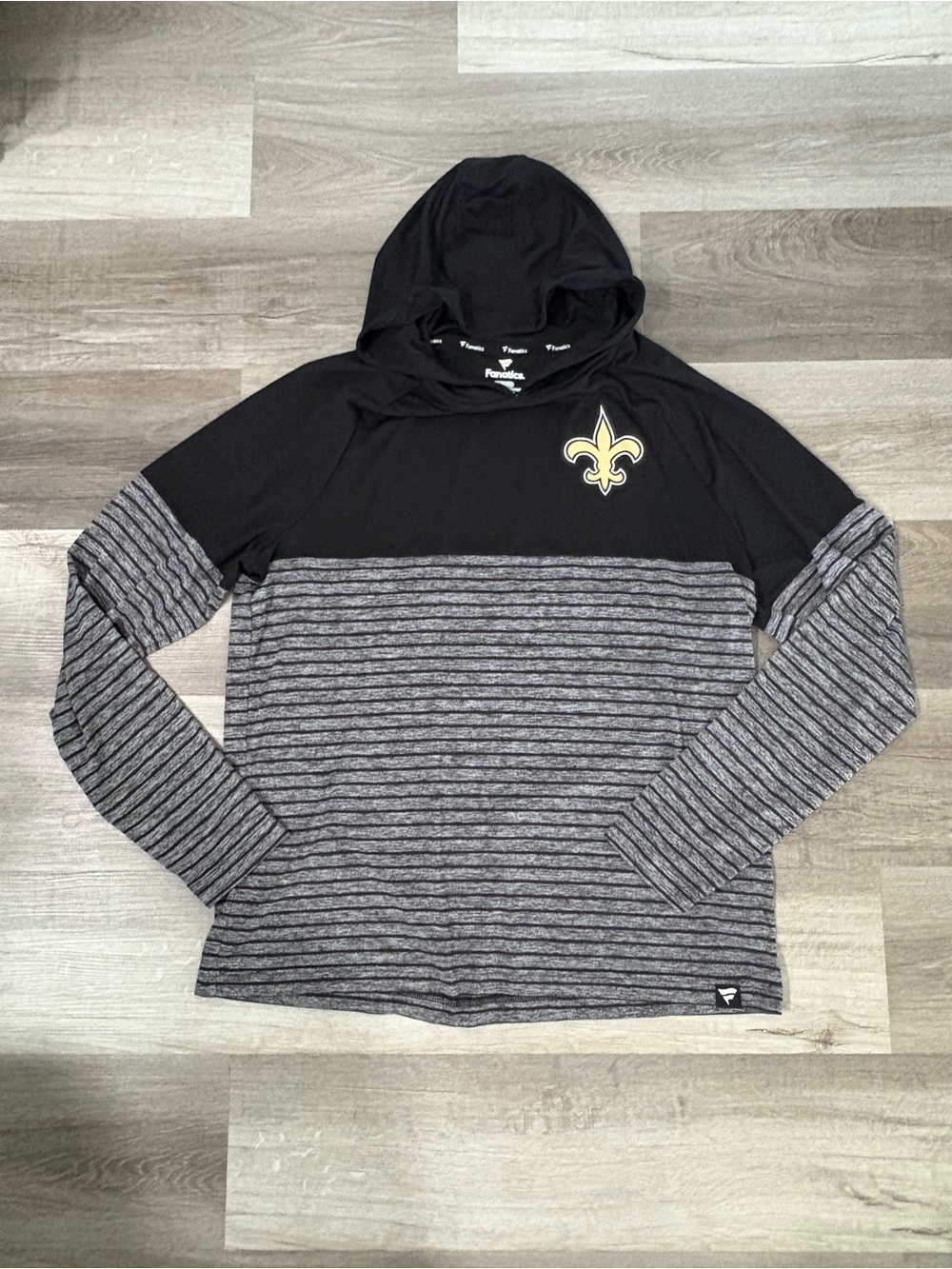 Fanatics Performance hooded long sleeve pullover featuring New Orleans Saints
